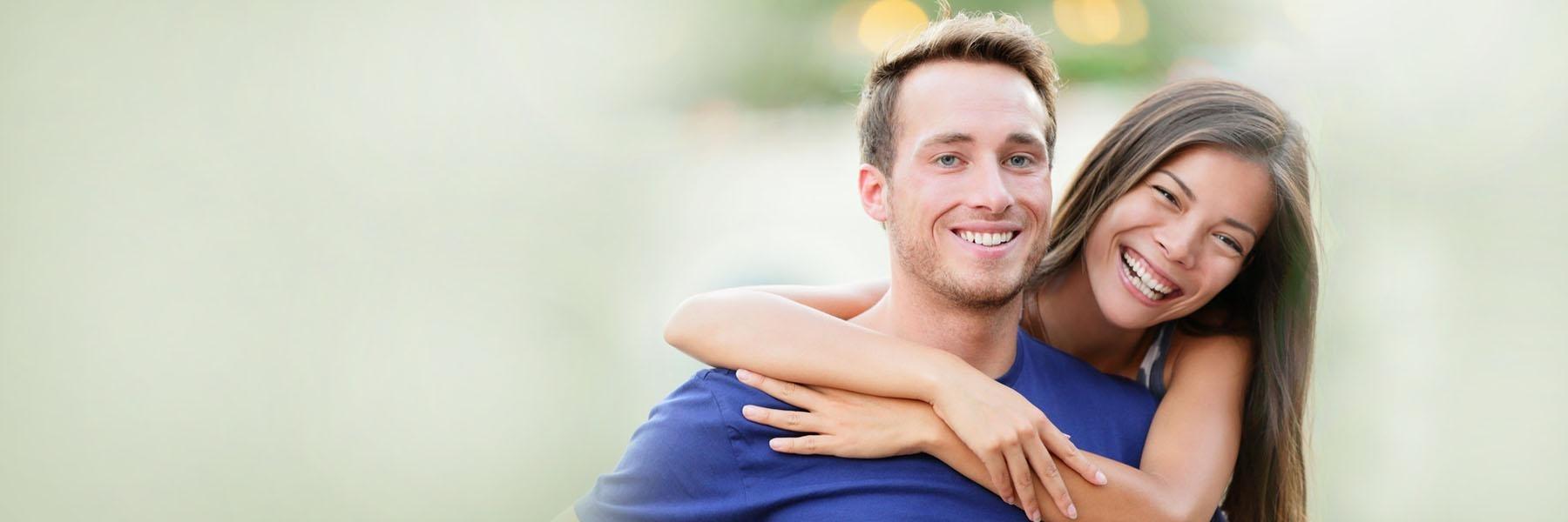 man and woman smiling