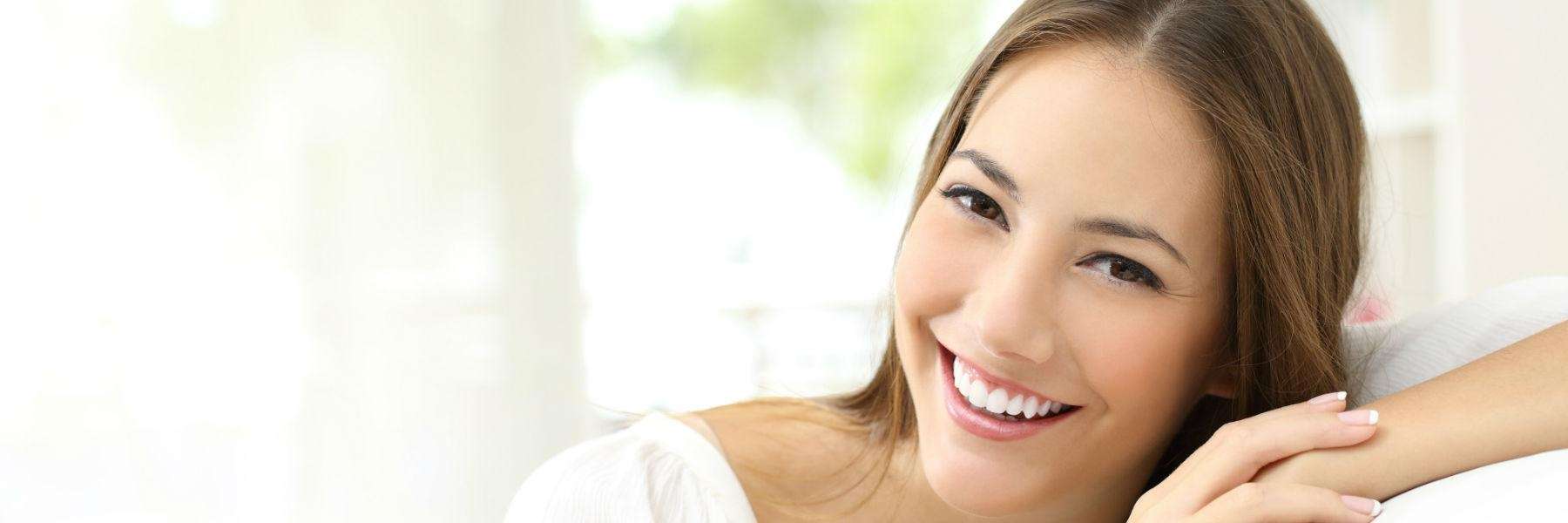 A woman smiling after undergoing a Root Canals treatment in Durham, NC