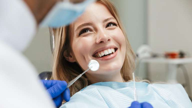 A woman doing a Preventive Dental Care in Durham, NC