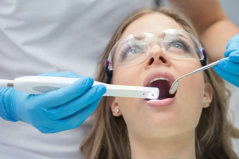 woman getting an oral cancer screening in durham nc