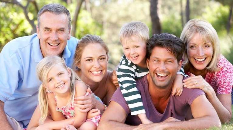 a family smiling after Comprehensive Family Dentistry in Durham, NC