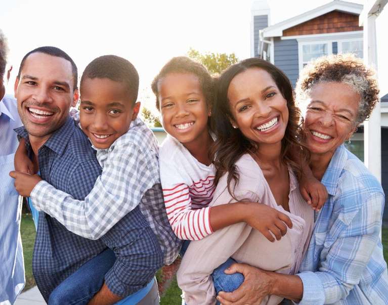 A family smiling after a Dentistry visit in Durham, NC